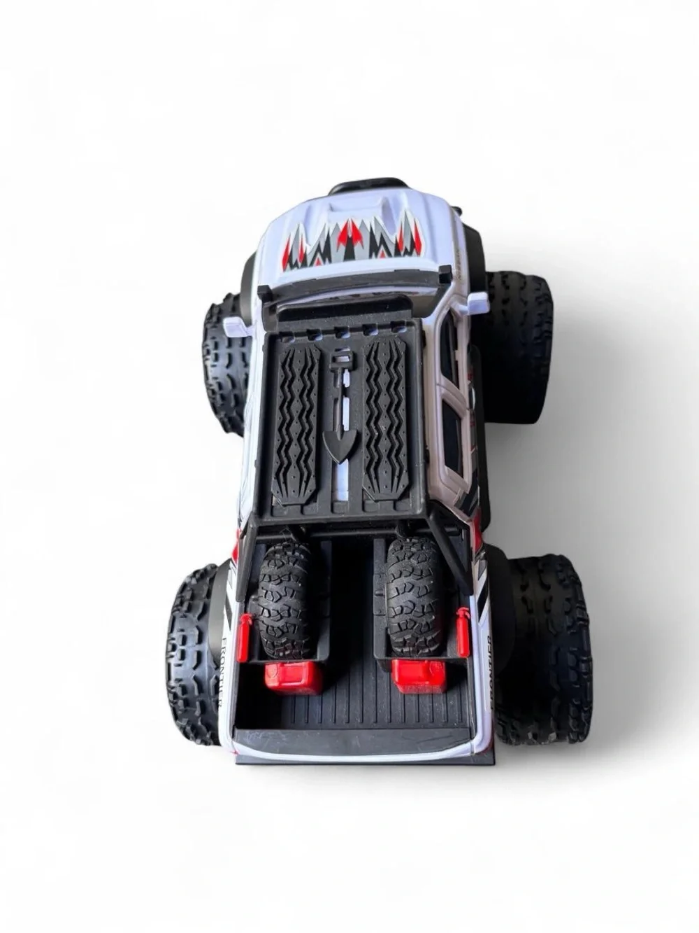 Nissan Frontier RC Truck with black & red lightning bolt graphics
